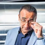 Carlo Conti Facebook: scelta inaspettata dopo gli insulti degli haters